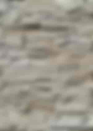 Hintergrundwand aus kleinen Steinmustern mit schöner Austrahlung aus imi-monyt Steinpaneel