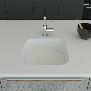 Küchenspüle PSE 375/420 aus Staron mit Spülenboden und Designabdeckung aus Staron Bright White. Fugenlos eingebaut in eine Arbeitsplatte aus Staron Bright White.