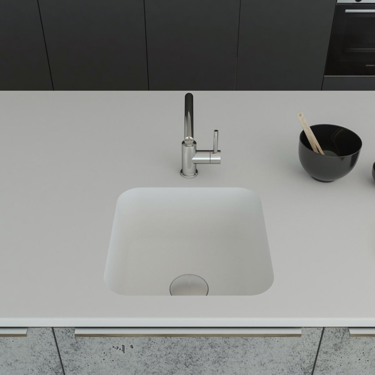 Gegossene Spüle A1181 komplett aus dem Mineralwerkstoff Staron mit einer Ablaufgarnitur, welche separat dazubestellt werden kann. Gefasst ist das Becken in einer Arbeitsplatte aus Staron Bright White. Breite 460mm, Tiefe 460mm