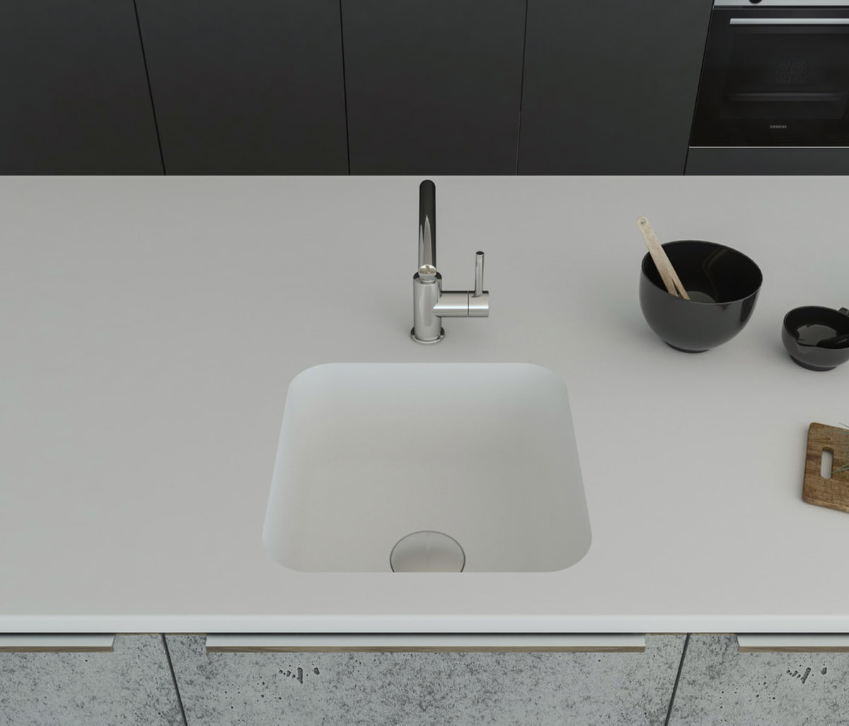 Gegossene Spüle A1181 komplett aus dem Mineralwerkstoff Staron mit einer Ablaufgarnitur, welche separat dazubestellt werden kann. Gefasst ist das Becken in einer Arbeitsplatte aus Staron Bright White. Breite 460mm, Tiefe 460mm