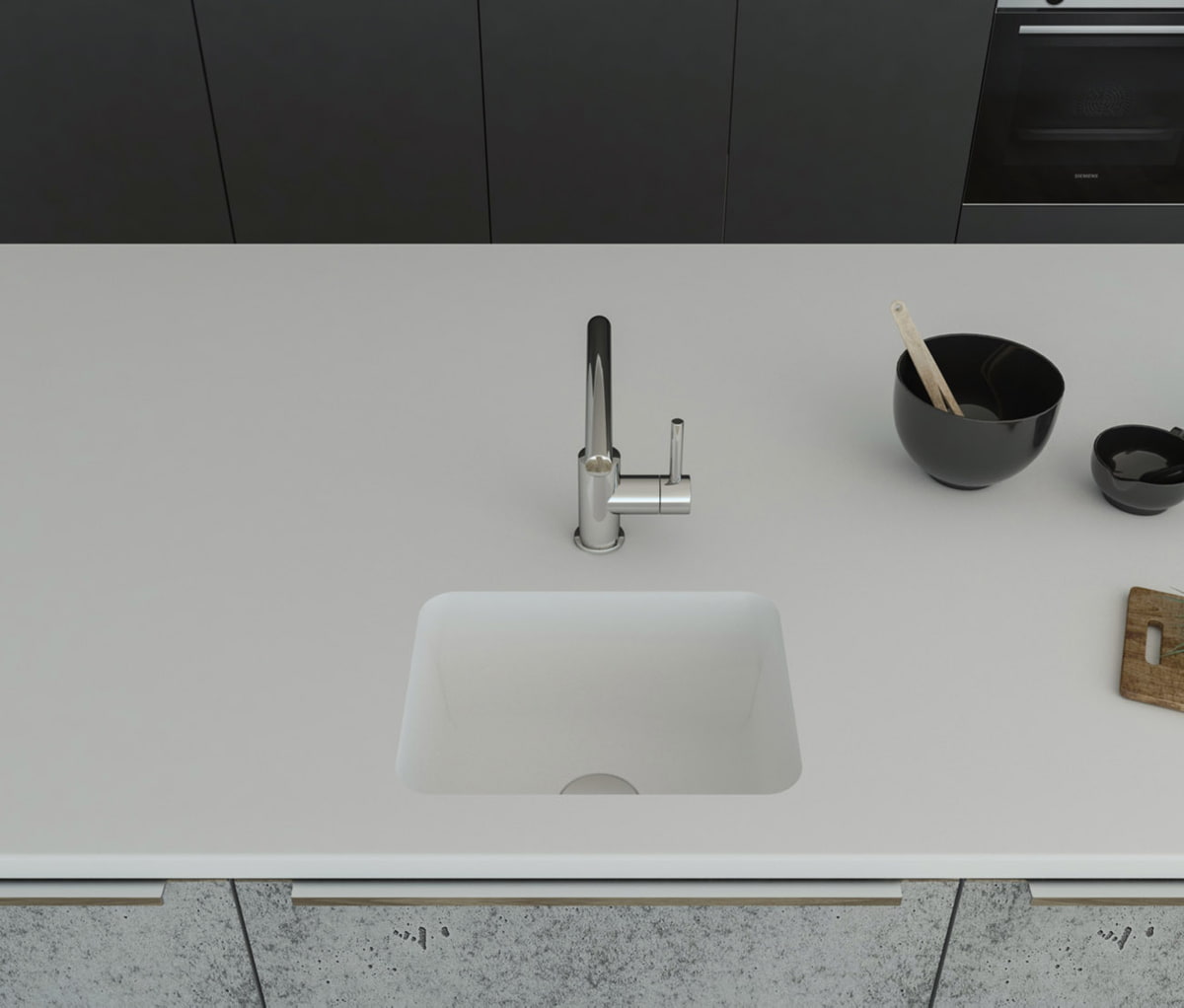 Gegossene Spüle A1121 mit Staronboden in Bright White mit Ablaufgarnitur AH1, welche separat bestell bar ist. Die Spüle ist in eine Arbeitsplatte in Bright White eingelassen. 