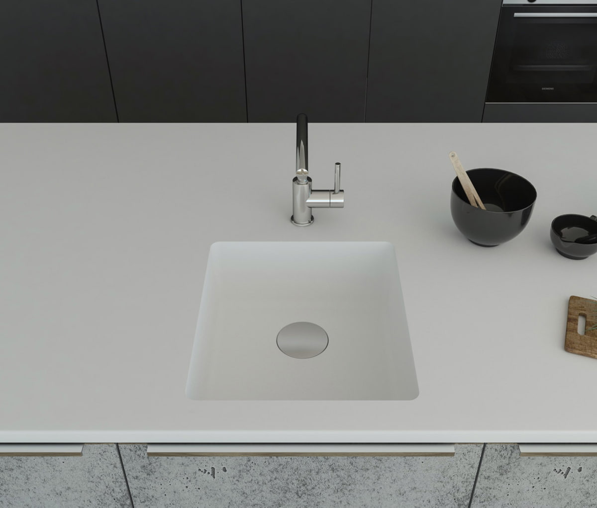 Gegossene Spüle B1177 mit Staronboden in Bright White mit Ablaufgarnitur AH1, welche separat bestell bar ist. Die Spüle ist in eine Arbeitsplatte in Bright White eingelassen. Breite 450 mm, Tiefe 500 mm