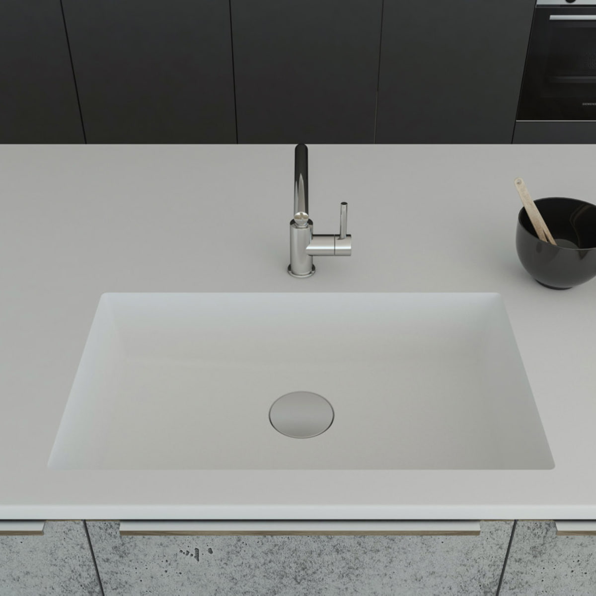 Gegossene Spüle B3290 mit Staronboden in Bright White mit Ablaufgarnitur AH1, welche separat bestell bar ist. Die Spüle ist in eine Arbeitsplatte in Bright White eingelassen. Breite 750 mm, Tiefe 450 mm