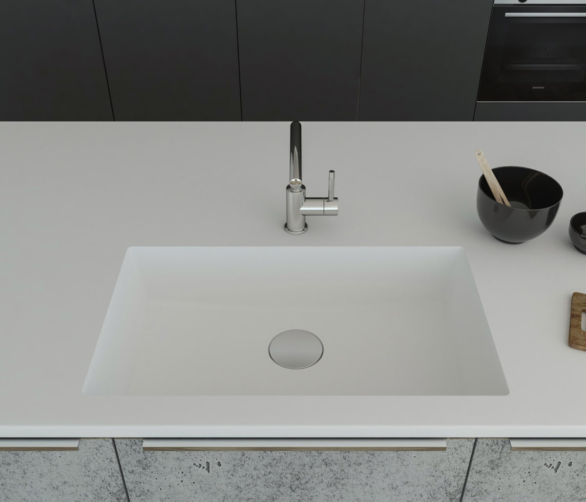 Gegossene Spüle B3290 mit Staronboden in Bright White mit Ablaufgarnitur AH1, welche separat bestell bar ist. Die Spüle ist in eine Arbeitsplatte in Bright White eingelassen. Breite 750 mm, Tiefe 450 mm