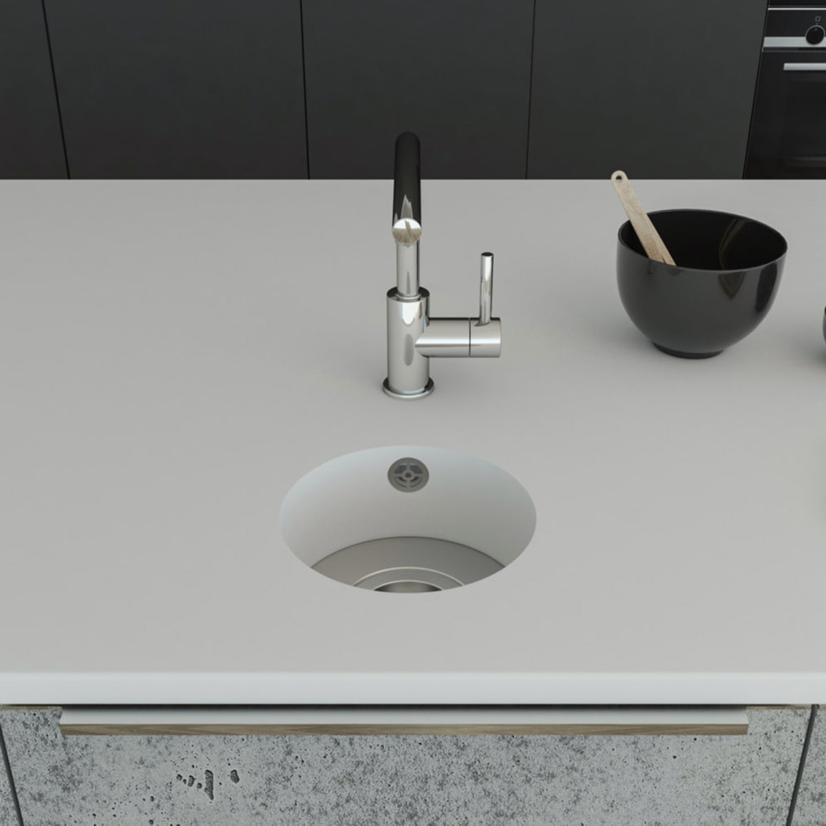 Küchenspüle rund PRSE199, Durchmesser 223 mm aus dem Mineralwerkstoff Staron in der Farbe Bright White mit einem Spülenboden aus Edelstahl und einer Ablaufgarnitur. Die Spüle wurde in eine Arbeitsplatte auch aus Staron Bright White fugenlos eingebaut. 