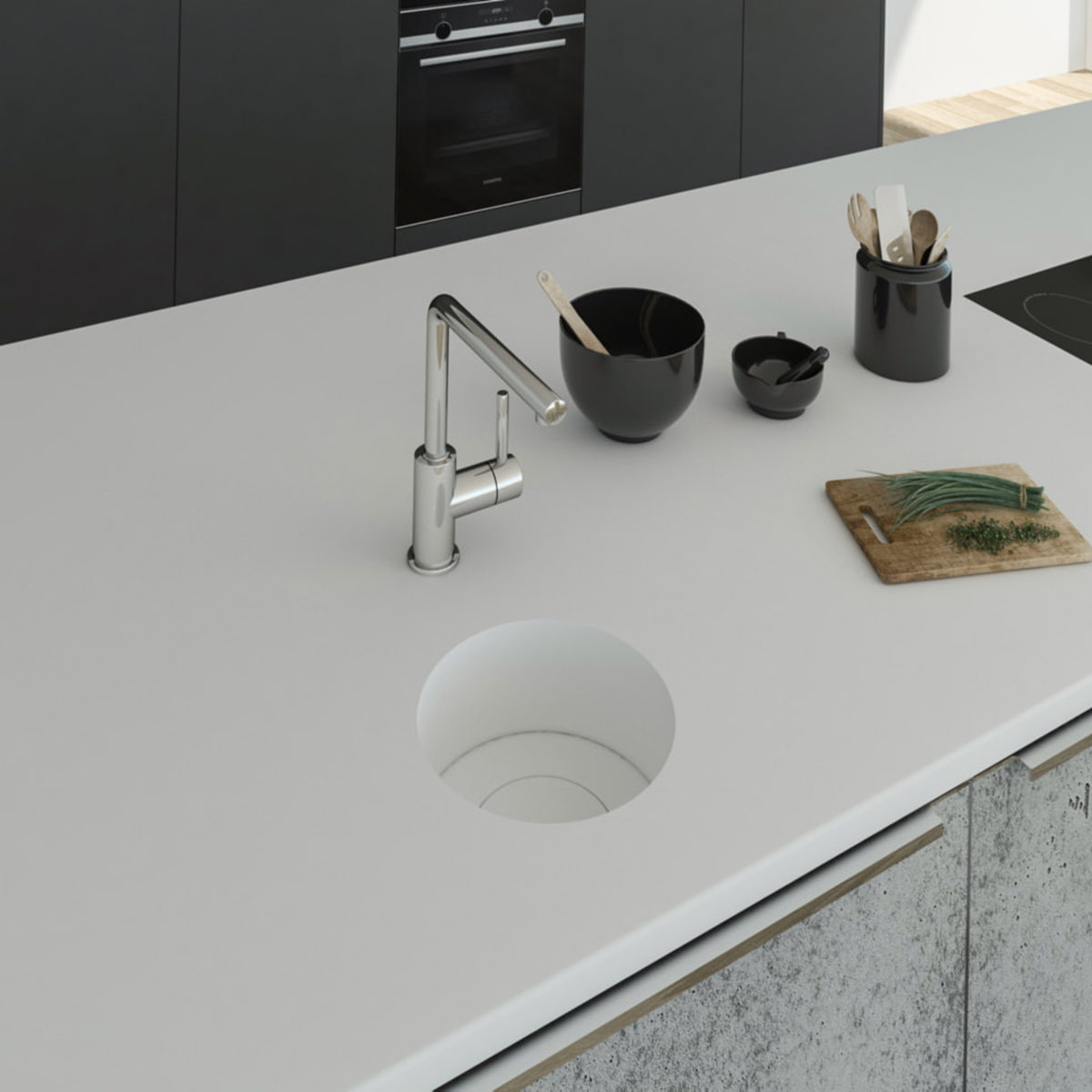 Küchenspüle rund PRSE199, Durchmesser 223 mm aus dem Mineralwerkstoff Staron in der Farbe Bright White mit einem Spülenboden aus Staron und einer Designabdeckung in Bright White. Die Spüle wurde in eine Arbeitsplatte auch aus Staron Bright White fugenlos 