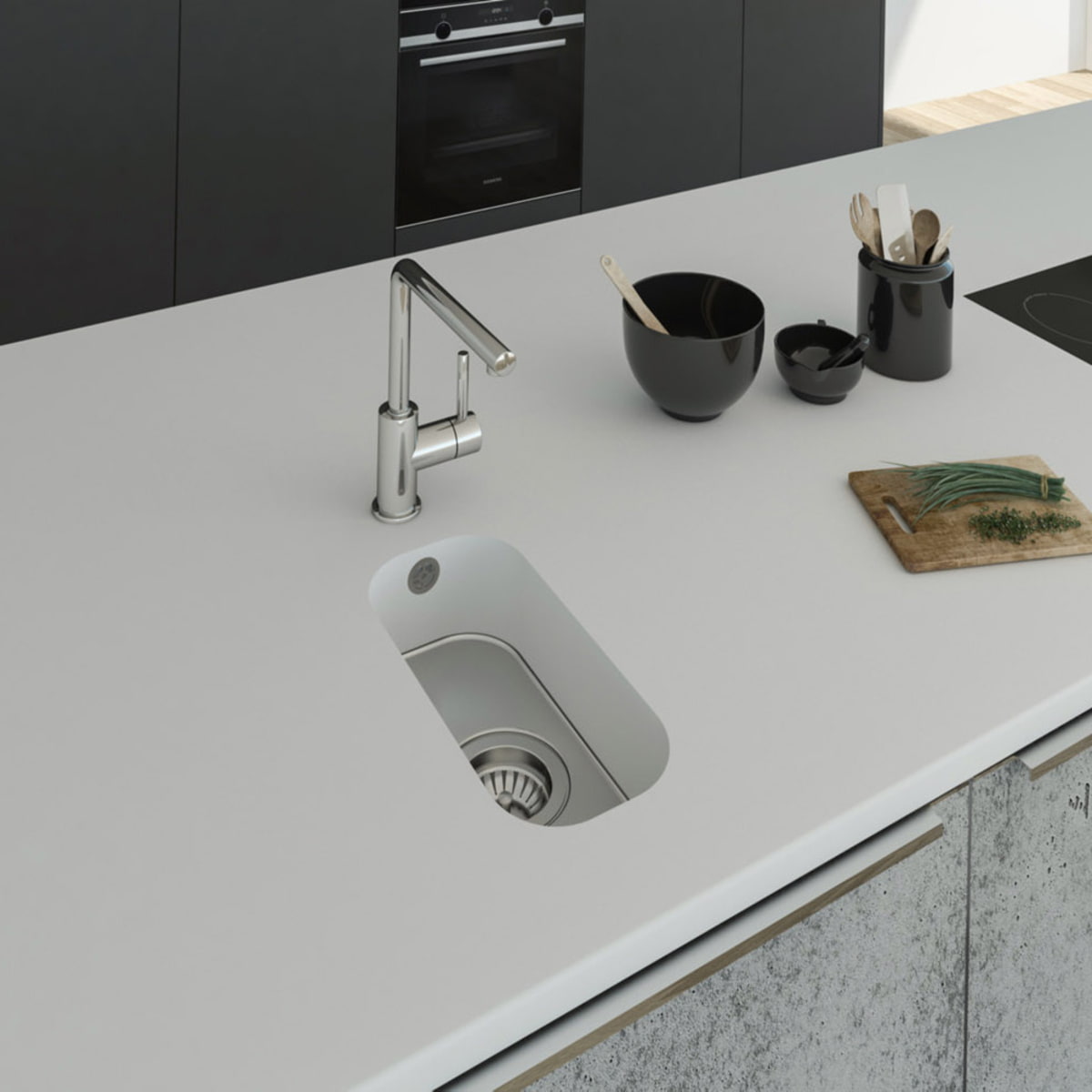 Küchenspüle PSE 162/352 aus Staron mit Spülenboden aus Edelstahl und einer Ablaufgarnitur. Fugenlos eingebaut in eine Arbeitsplatte aus Staron Bright White.