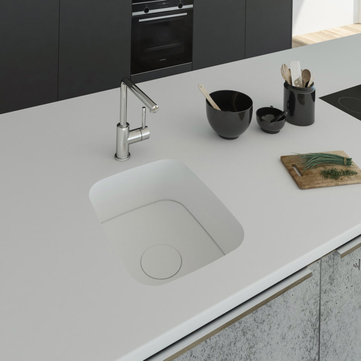 Küchenspüle PSE 332/418 aus Staron mit Spülenboden und Designabdeckung aus Staron Bright White. Fugenlos eingebaut in eine Arbeitsplatte aus Staron Bright White.