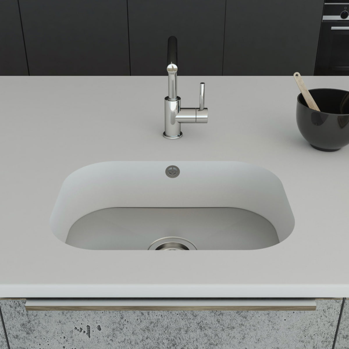 Küchenspüle PSE 495/345 mit Spülenboden aus Edelstahl mit einem Universalventil und einer Überlaufbohrung; eingebaut in eine Arbeitsplatte aus Staron Bright White mit Standarmatur