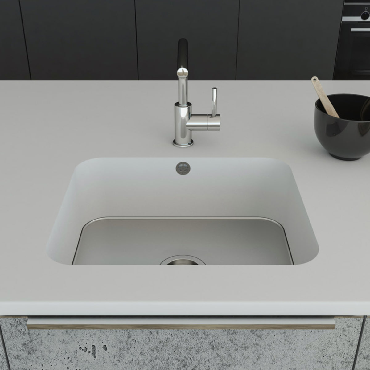 Küchenspüle PSE 500/412 mit Spülenboden aus Edelstahl und Universalventil; eingebaut in eine Arbeitsplatte in Staron Bright White und einer Standarmatur